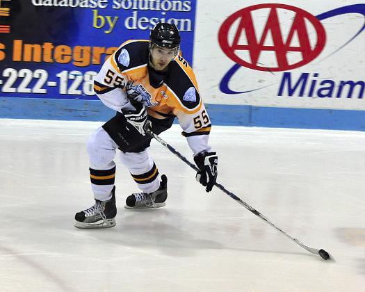 Mike Vaskivuo carrying the puck up ice